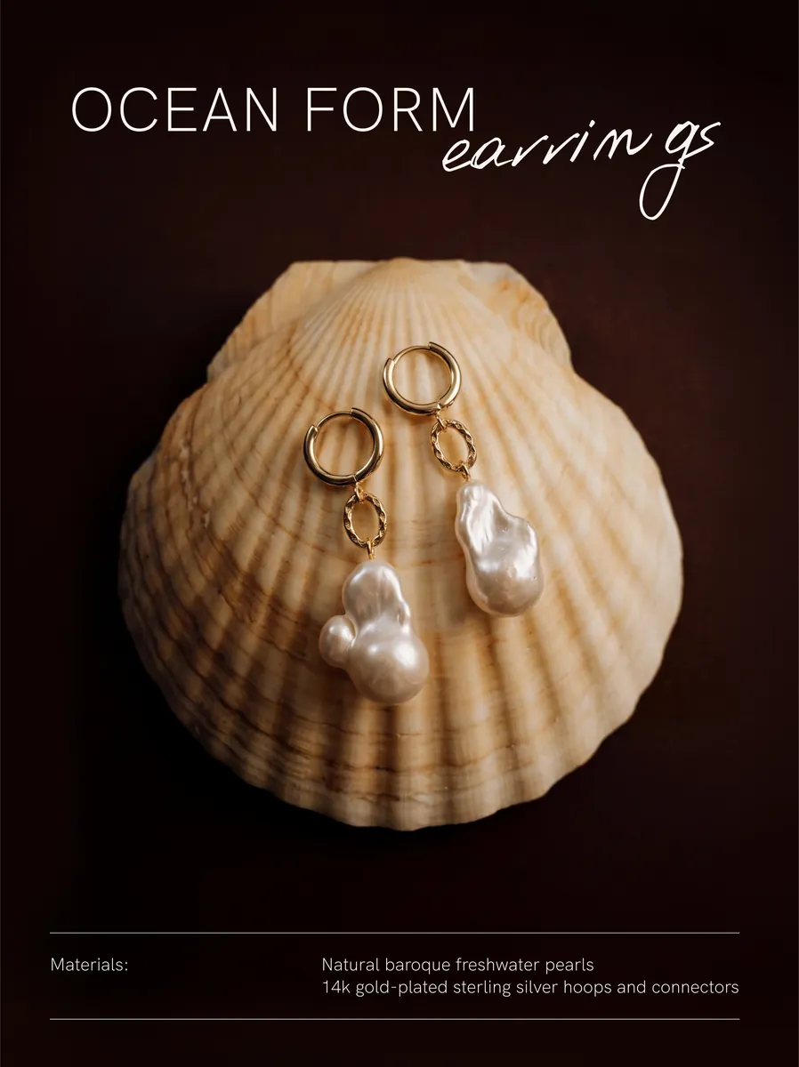 Ocean Form earrings on a shell